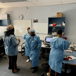 A team of doctors and nurses at The Headache Clinic preparing for a patient's procedure.