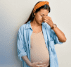 A pregnant female experiencing a painful sinus headache.